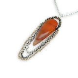 Smooth carnelian long drop with gold filled, sterling, and darkened sterling chain cascades on an arch or pyrite gemstones necklace