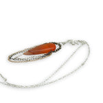 Smooth carnelian long drop with gold filled, sterling, and darkened sterling chain cascades on an arch or pyrite gemstones necklace