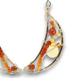 Bronze moon shaped earrings filled with carnelian, citrine, red cubic zirconia, and a citrine smooth teardrop on sterling silver wire