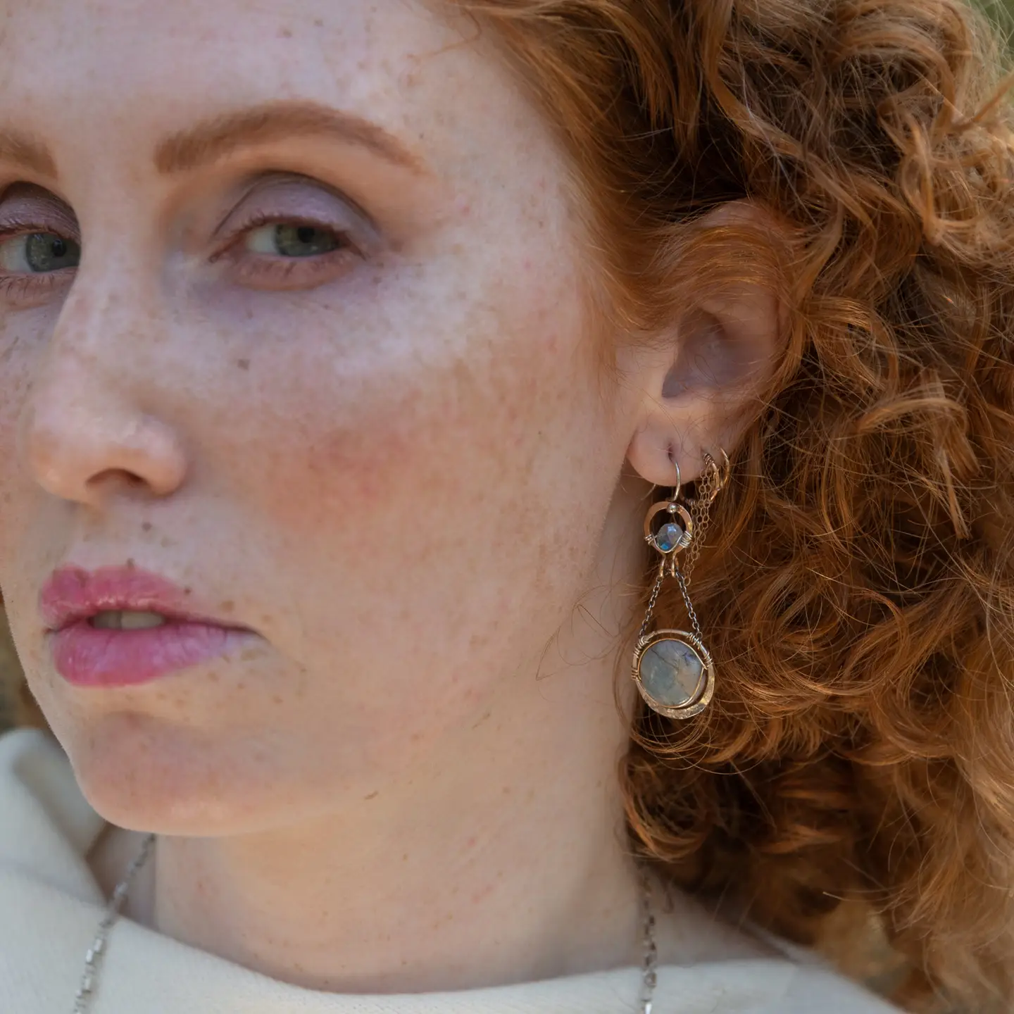 Sterling silver earrings with smooth aquamarine coins and crystal wrapped in gold-filled wire, accompanied by dainty sterling silver chain.