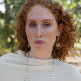 Sterling silver earrings with smooth aquamarine coins and crystal wrapped in gold-filled wire, accompanied by dainty sterling silver chain.