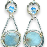 Sterling silver earrings with smooth aquamarine coins and crystal wrapped in gold-filled wire, accompanied by dainty sterling silver chain.