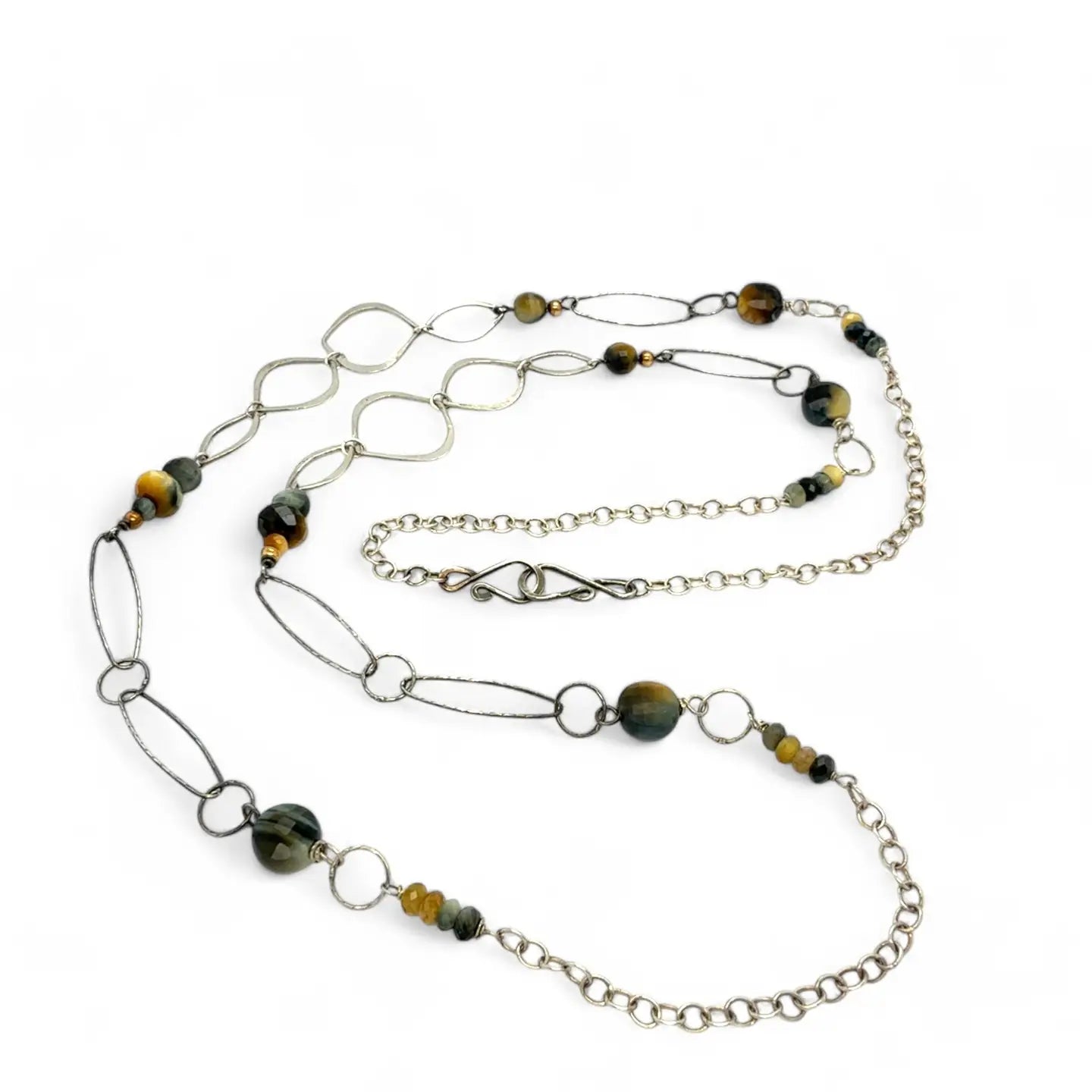handmade hammered marquise links mixed with cat's eye gemstones, sparkly sterling silver links, and sterling silver chain form a long necklace