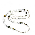 handmade hammered marquise links mixed with cat's eye gemstones, sparkly sterling silver links, and sterling silver chain form a long necklace