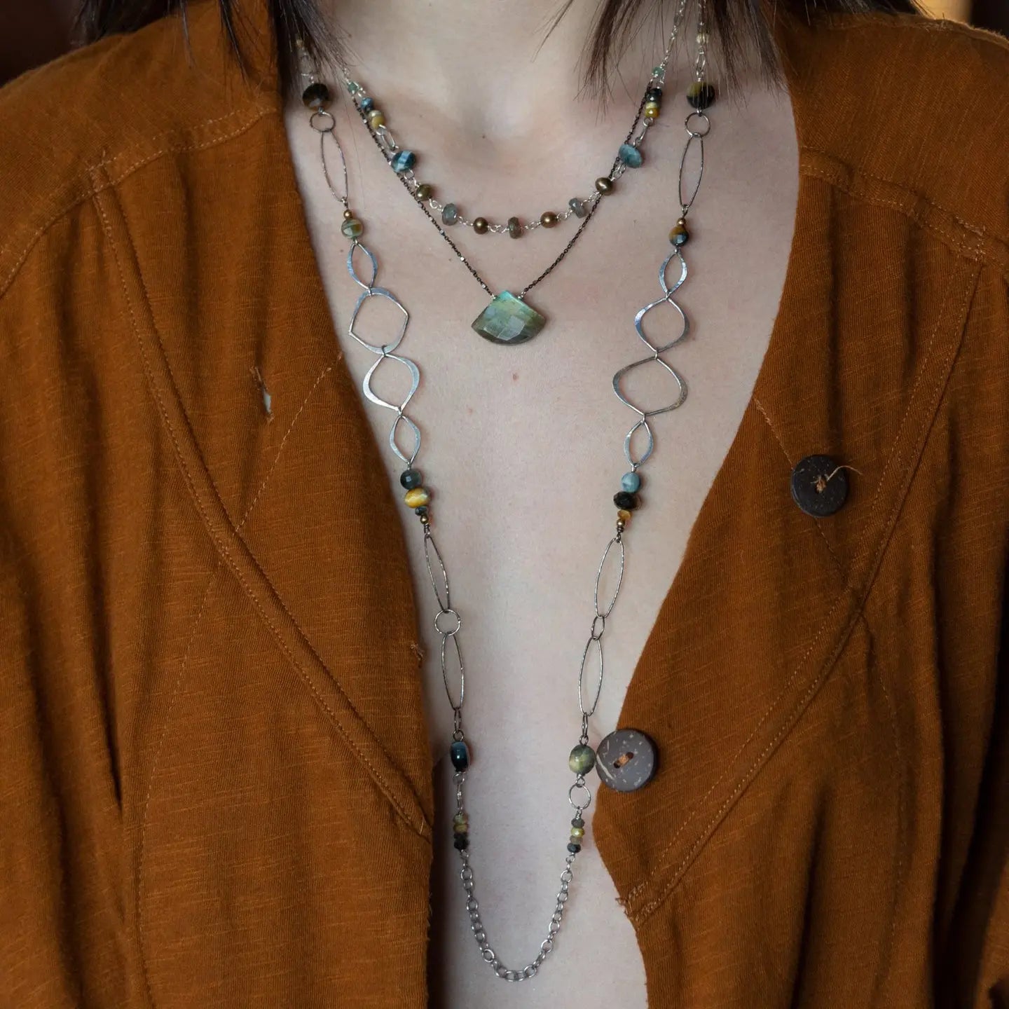 handmade hammered marquise links mixed with cat's eye gemstones, sparkly sterling silver links, and sterling silver chain form a long necklace