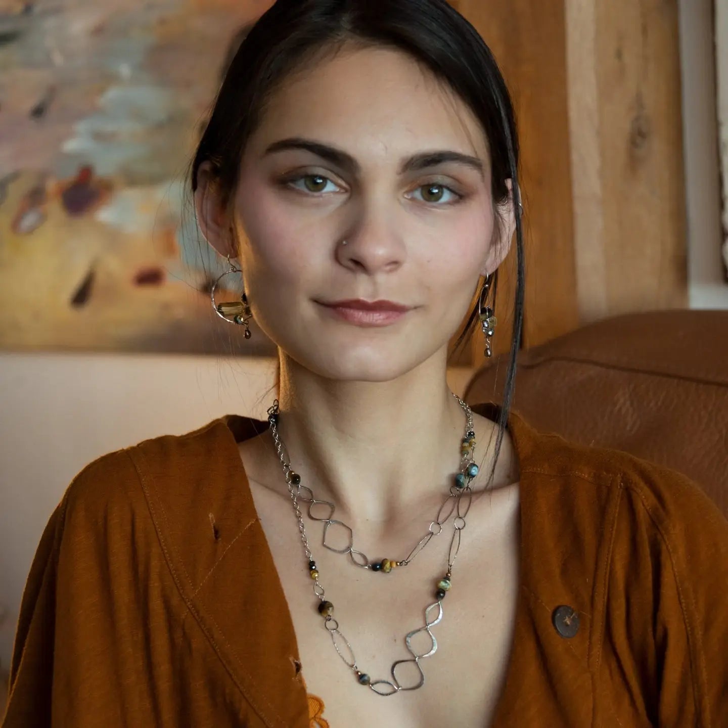 handmade hammered marquise links mixed with cat's eye gemstones, sparkly sterling silver links, and sterling silver chain form a long necklace