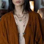 handmade hammered marquise links mixed with cat's eye gemstones, sparkly sterling silver links, and sterling silver chain form a long necklace