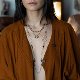 handmade hammered marquise links mixed with cat's eye gemstones, sparkly sterling silver links, and sterling silver chain form a long necklace