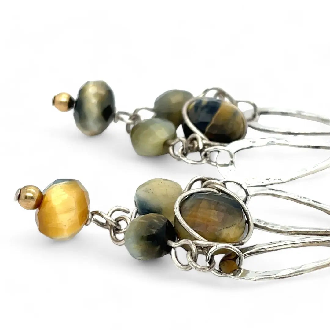 A pair of sterling silver chandelier earrings with cat's eye cut gemstones in various colors