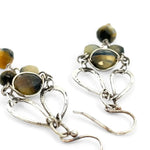 A pair of sterling silver chandelier earrings with cat's eye cut gemstones in various colors