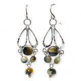 A pair of sterling silver chandelier earrings with cat's eye cut gemstones in various colors
