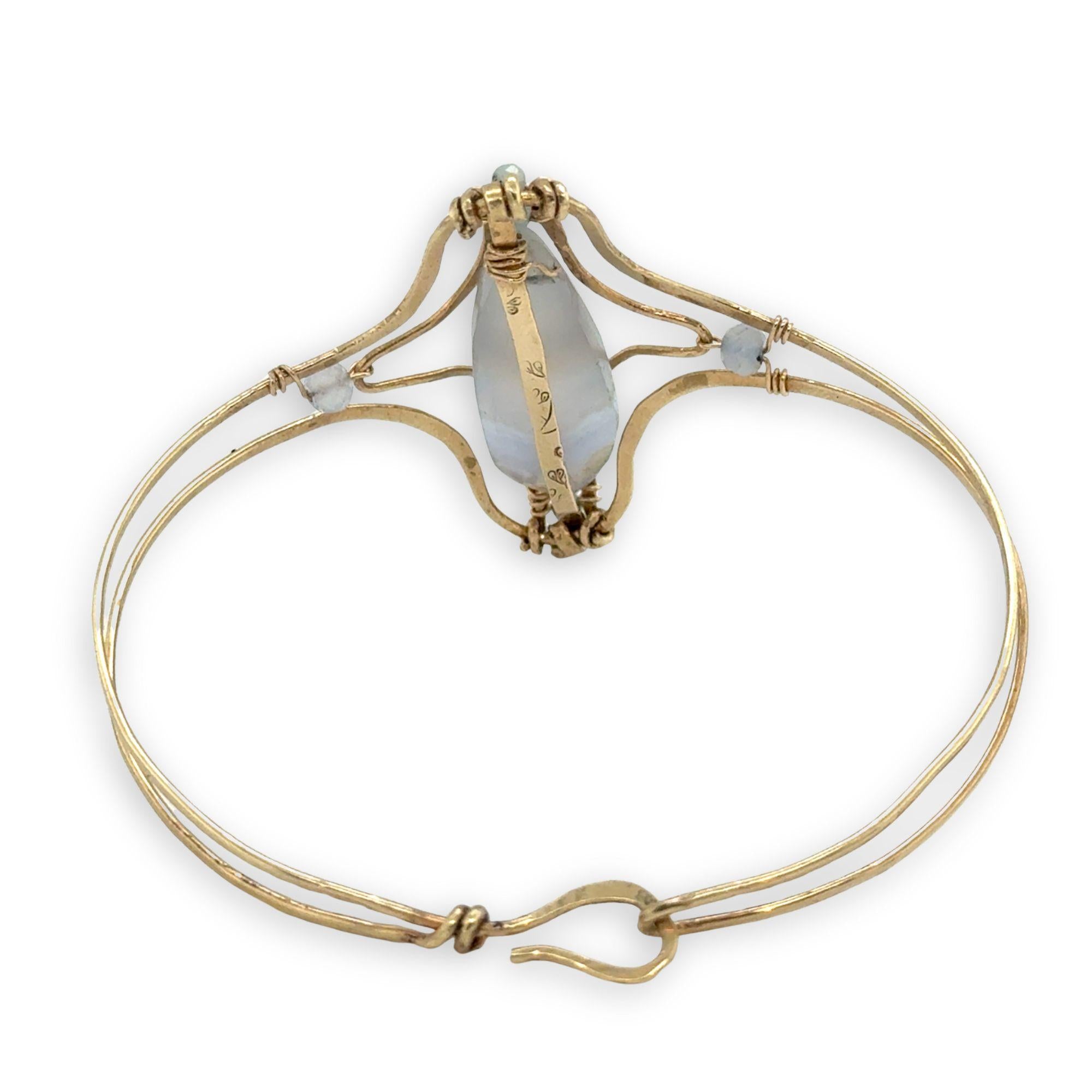 hammered and leaf stamped brass statement bracelet with large blue lace agate drop center