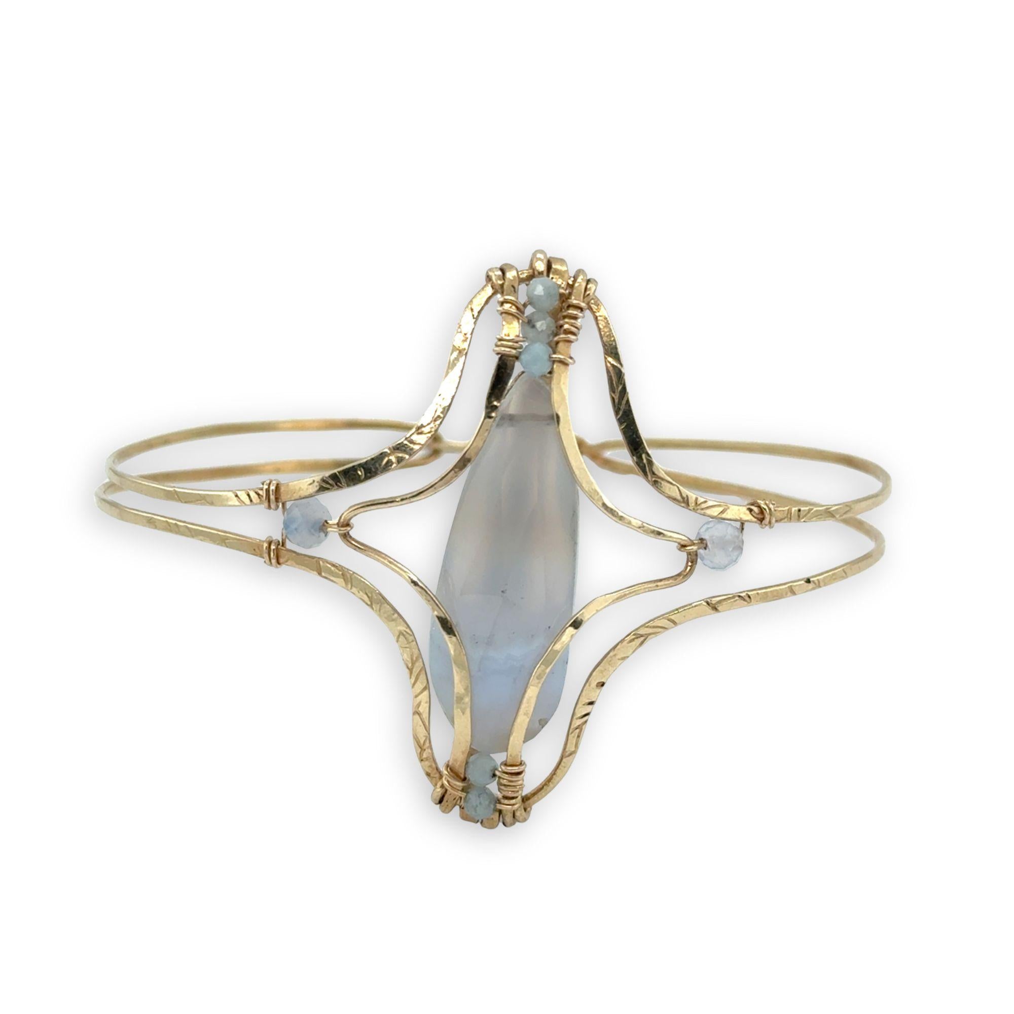 hammered and leaf stamped brass statement bracelet with large blue lace agate drop center