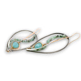 Oxidized sterling silver twist drop earrings with chalcedony gemstones set in gold filled wire with emerald gemstones and sterling silver accents