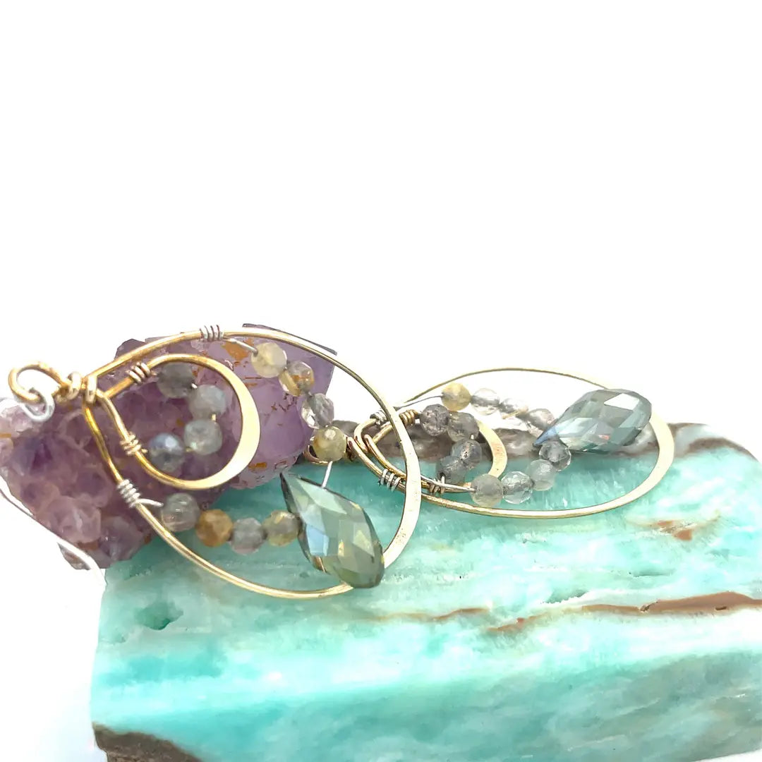 Double drop brass earrings with rutilated quartz, labradorite faceted gemstones, and a blue green crystal drop held on gold-filled and sterling silver wires