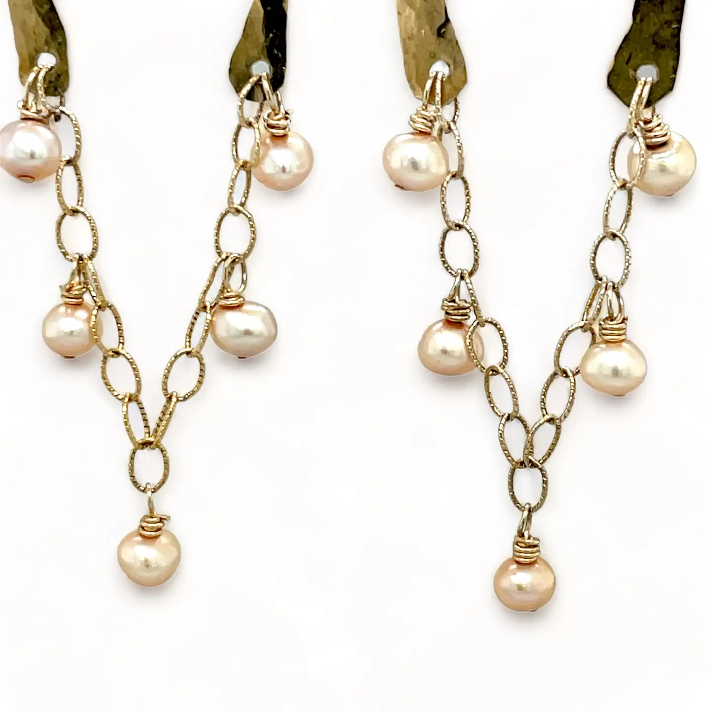 Shiny brass arch earrings with gold-filled chain cascading with champagne colored fresh water pearls.