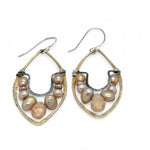 Pink and champagne colored fresh water pearls combined with a peach opalescent faceted drop gemstone sit inside a brass stamped marquise earring with sterling silver accent