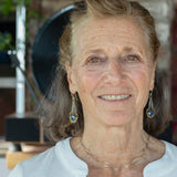 Handmade leaf stamped brass chariots hanging from double up oxidized sterling silver dainty chain, holding a blue faceted hexagonal crystal earring