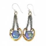 Handmade leaf stamped brass chariots hanging from double up oxidized sterling silver dainty chain, holding a blue faceted hexagonal crystal earring