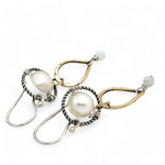 Brass hammered teardrops hanging from oxidized braided sterling rings holding a round fresh water pearl and faceted aquamarine earrings