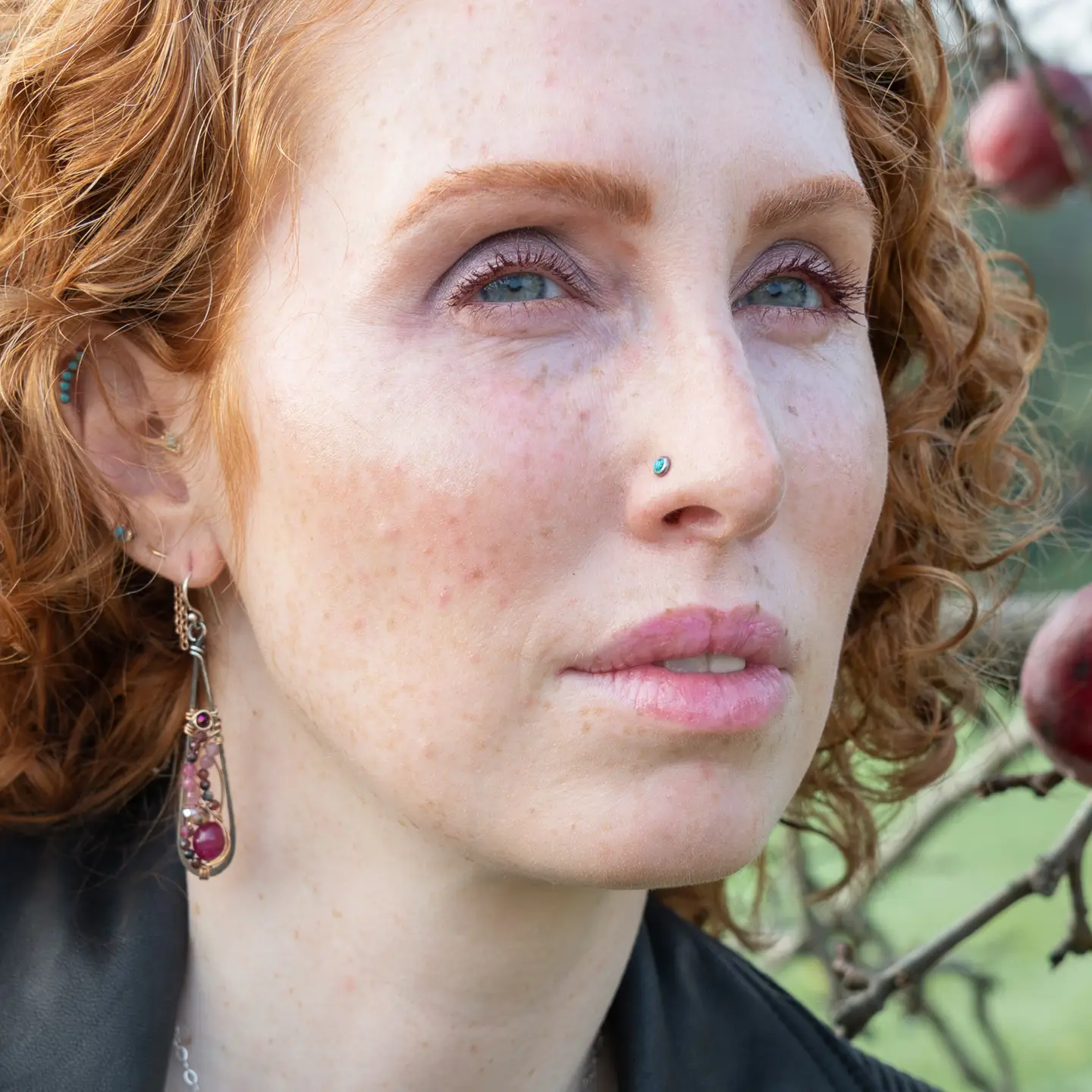 oxidized sterling silver skinny drop earrings with hammered bronze wire, smooth ruby nuggets, pink tourmaline, and garnet gemstones on gold filled wire