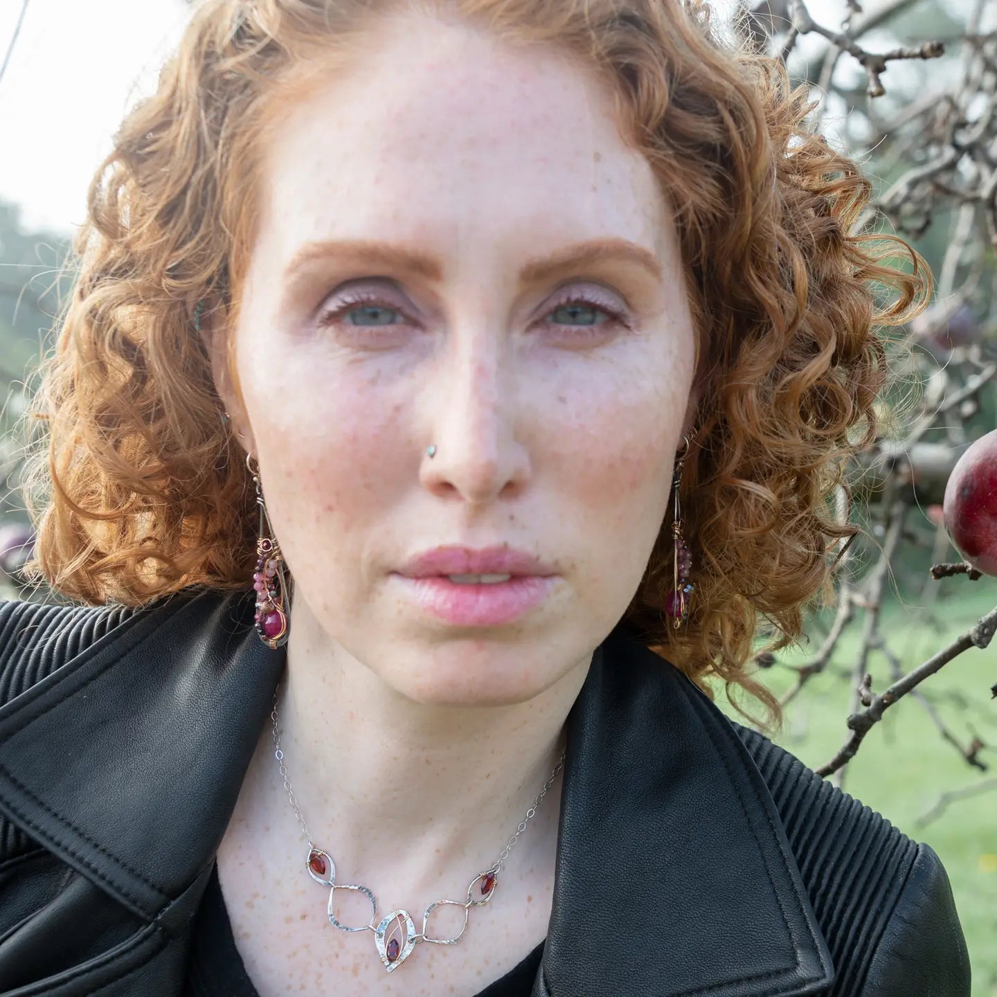 oxidized sterling silver skinny drop earrings with hammered bronze wire, smooth ruby nuggets, pink tourmaline, and garnet gemstones on gold filled wire