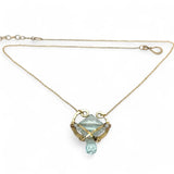 brass hammered mini pendant with aqua quartz tile lined in light blue cat's eye tiny gemstones with a faceted blue quartz drop at the bottom on gold filled chain necklace