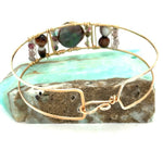 Chocolate pearl coin, striped brown agate, watermelon tourmaline, and cherry rutilated quartz gemstones held within our handmade bronze cuff on gold filled wire