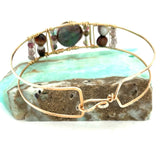 Chocolate pearl coin, striped brown agate, watermelon tourmaline, and cherry rutilated quartz gemstones held within our handmade bronze cuff on gold filled wire