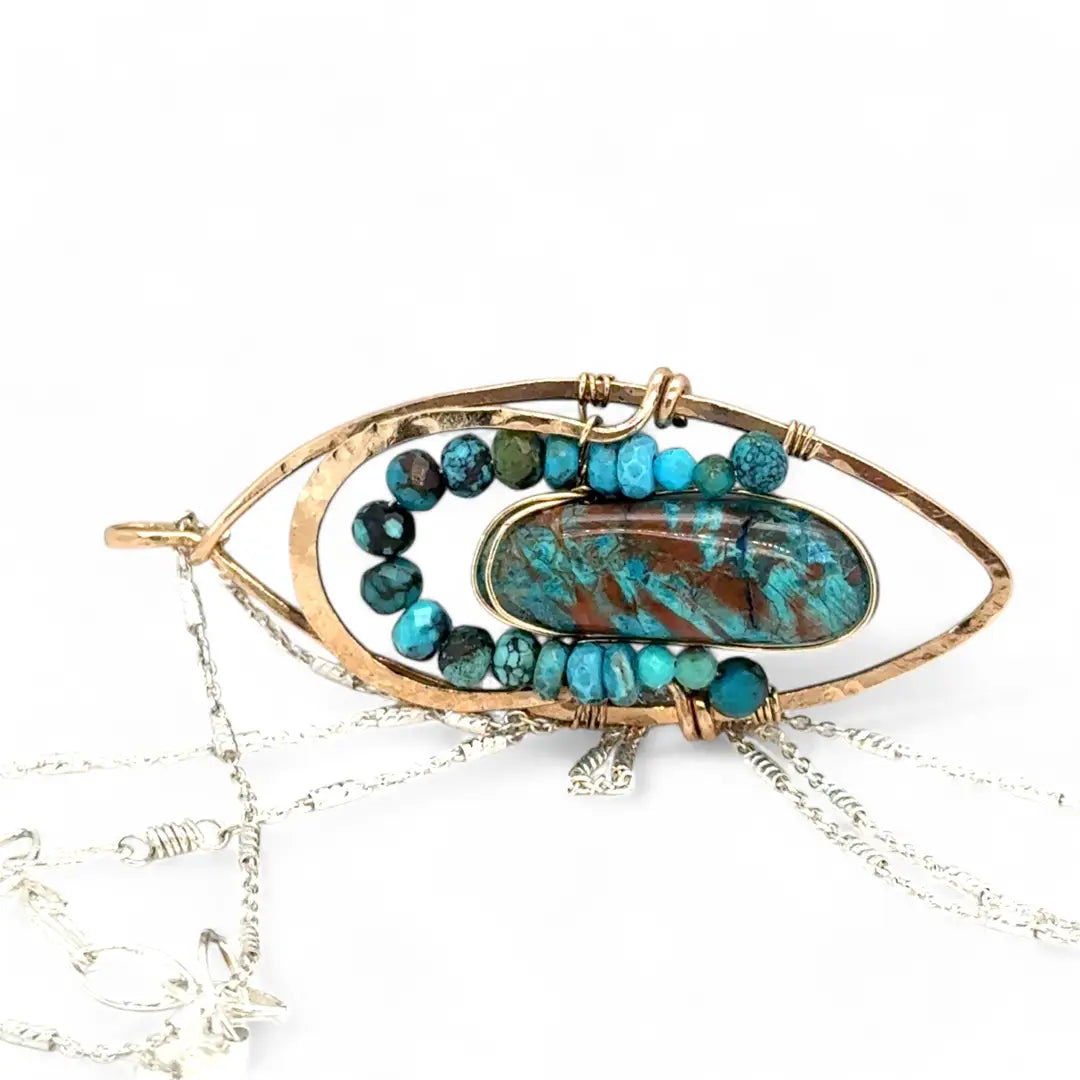 Bronze marquise pendant with a smooth chrysocolla drop nugget outlined in turquoise faceted gemstones on a sterling silver chain necklace