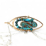 Bronze marquise pendant with a smooth chrysocolla drop nugget outlined in turquoise faceted gemstones on a sterling silver chain necklace