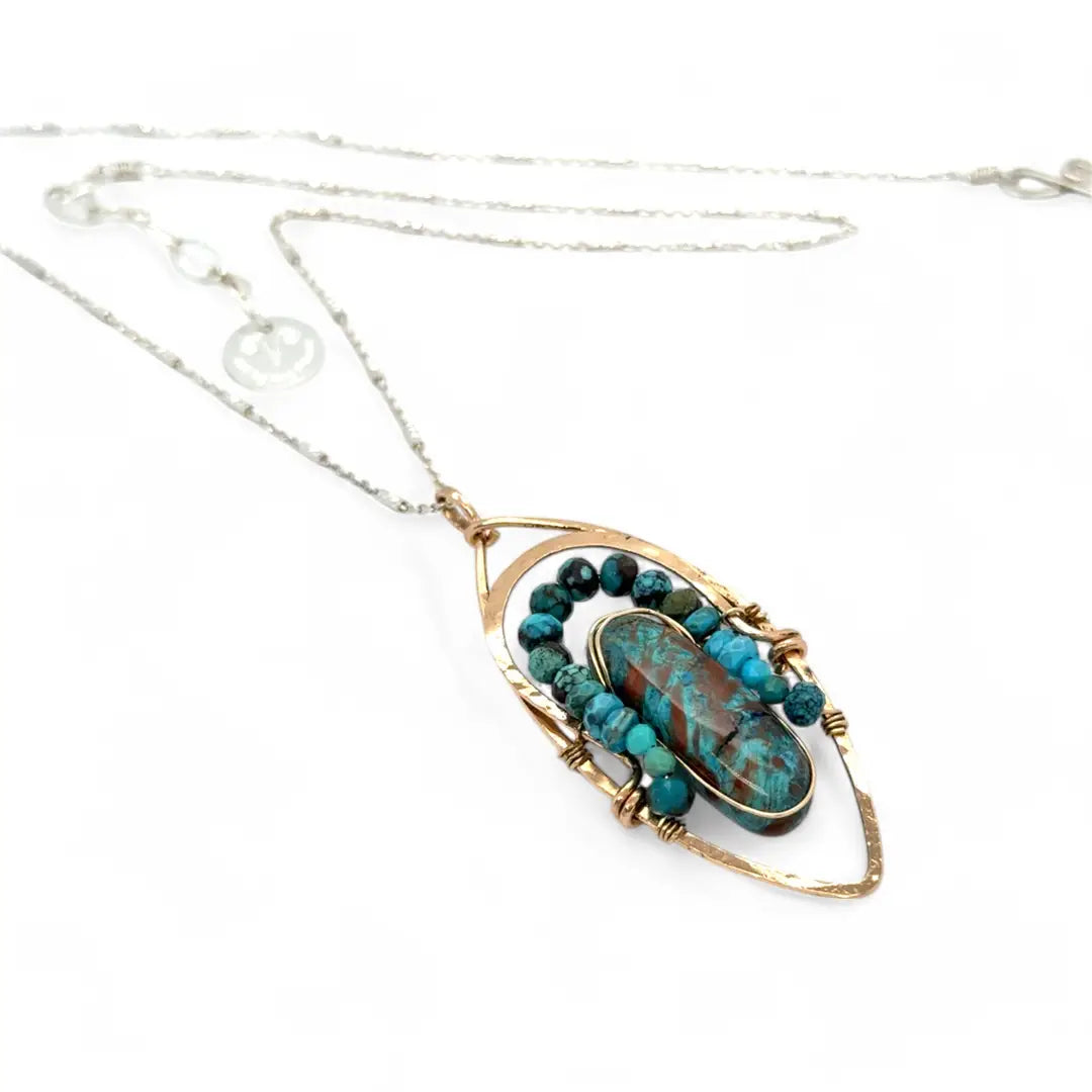 Bronze marquise pendant with a smooth chrysocolla drop nugget outlined in turquoise faceted gemstones on a sterling silver chain necklace