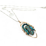 Bronze marquise pendant with a smooth chrysocolla drop nugget outlined in turquoise faceted gemstones on a sterling silver chain necklace