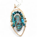 Bronze marquise pendant with a smooth chrysocolla drop nugget outlined in turquoise faceted gemstones on a sterling silver chain necklace