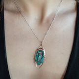 Bronze marquise pendant with a smooth chrysocolla drop nugget outlined in turquoise faceted gemstones on a sterling silver chain necklace