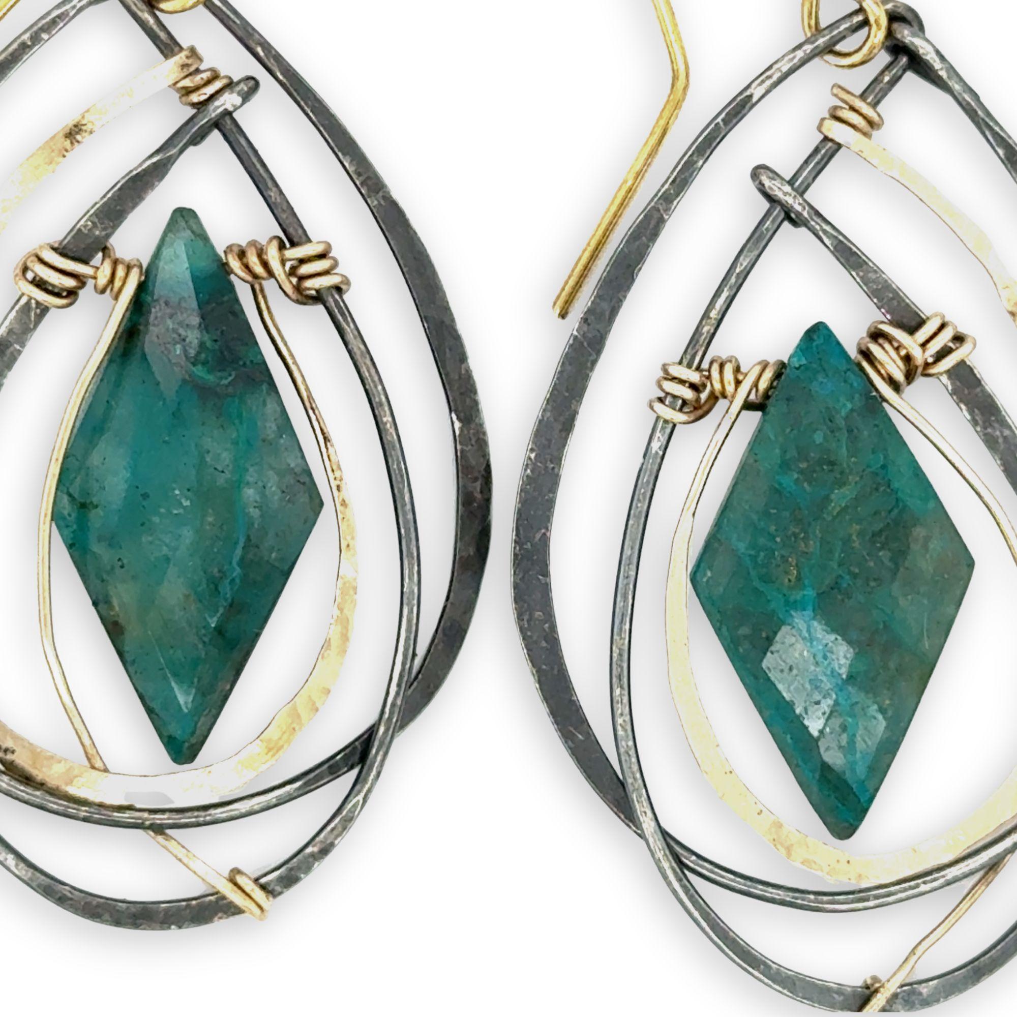 Double pointed chrysocolla gemstones are held in layers of gold filled and oxidized sterling silver earrings
