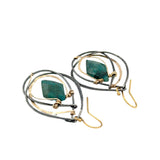 Double pointed chrysocolla gemstones are held in layers of gold filled and oxidized sterling silver earrings