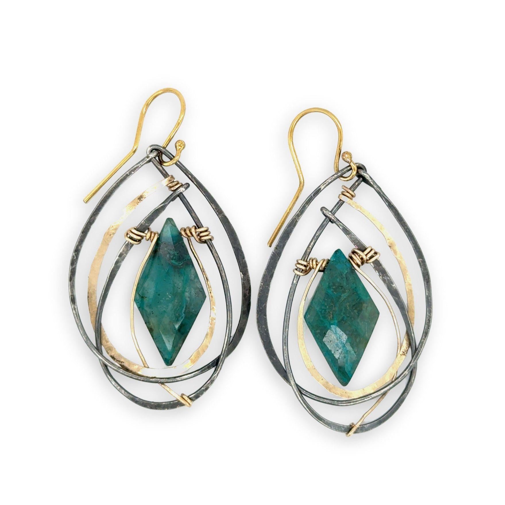 Double pointed chrysocolla gemstones are held in layers of gold filled and oxidized sterling silver earrings