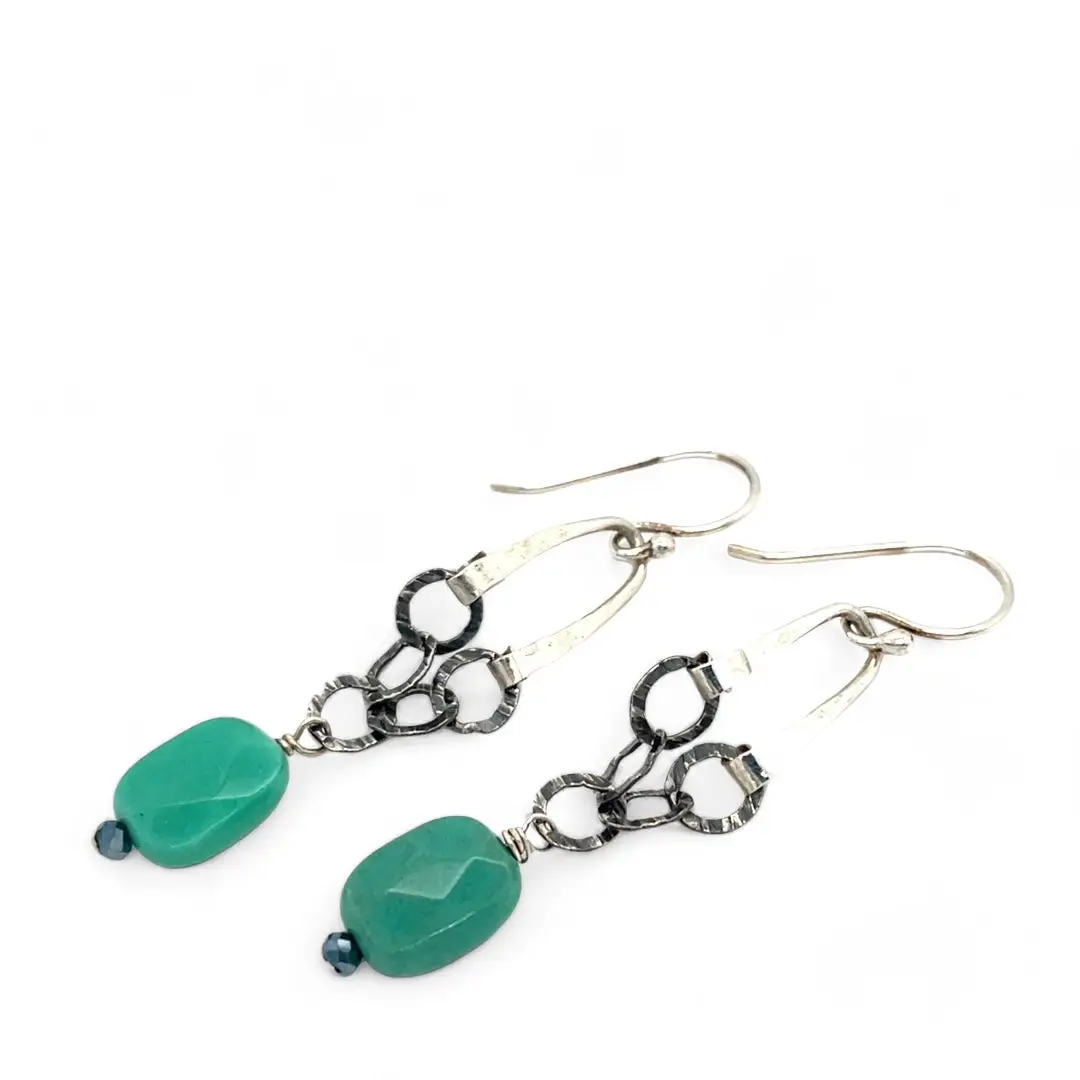 A pair of chandelier earrings with faceted chrysoprase gemstones, textured oxidized sterling silver chains
