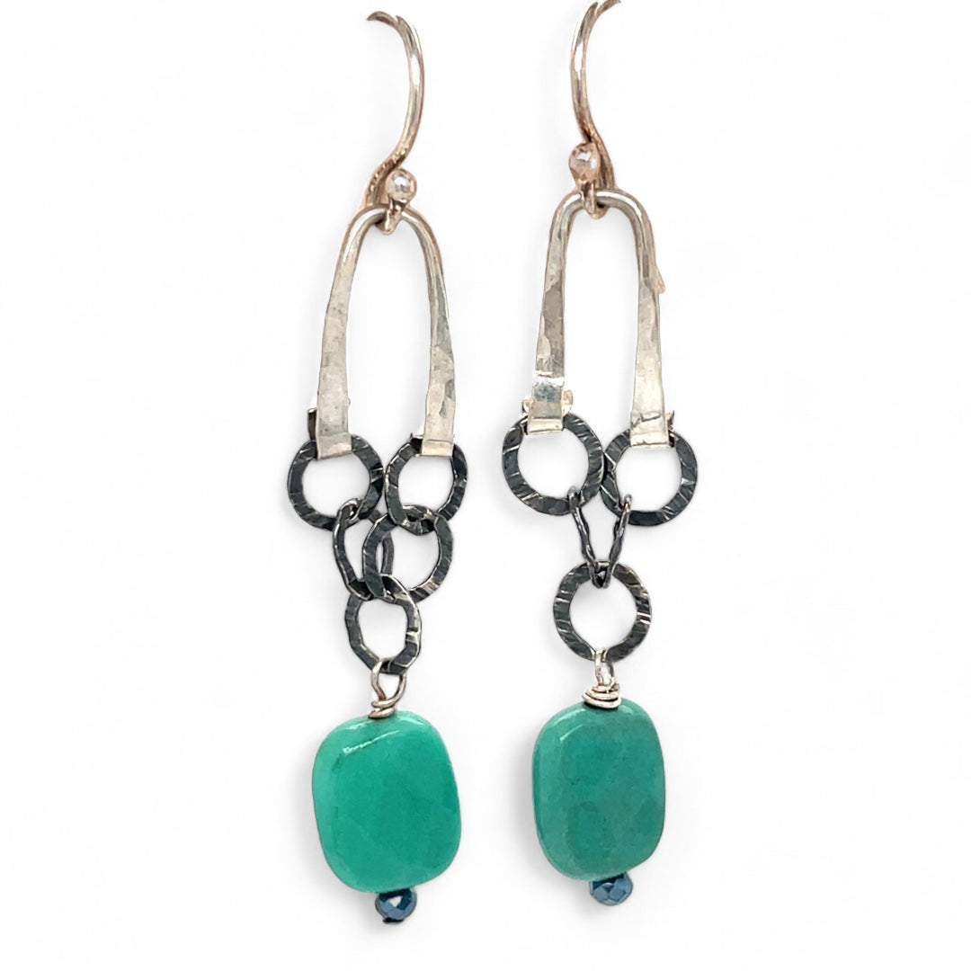 A pair of chandelier earrings with faceted chrysoprase gemstones, textured oxidized sterling silver chains