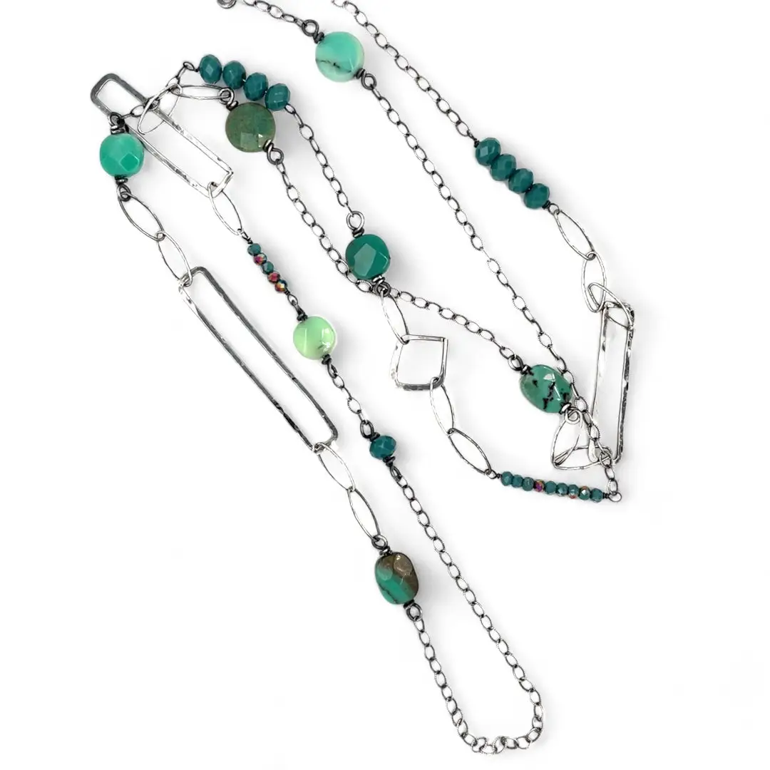 Handmade darkened sterling silver rectangle and diamond links interspersed with sparkly diamond cut links, teal crystal, and chrysoprase gemstones to form this long necklace that can be worn at any length