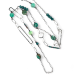 Handmade darkened sterling silver rectangle and diamond links interspersed with sparkly diamond cut links, teal crystal, and chrysoprase gemstones to form this long necklace that can be worn at any length