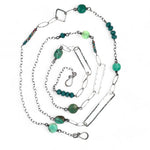 Handmade darkened sterling silver rectangle and diamond links interspersed with sparkly diamond cut links, teal crystal, and chrysoprase gemstones to form this long necklace that can be worn at any length