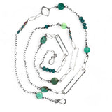 Handmade darkened sterling silver rectangle and diamond links interspersed with sparkly diamond cut links, teal crystal, and chrysoprase gemstones to form this long necklace that can be worn at any length