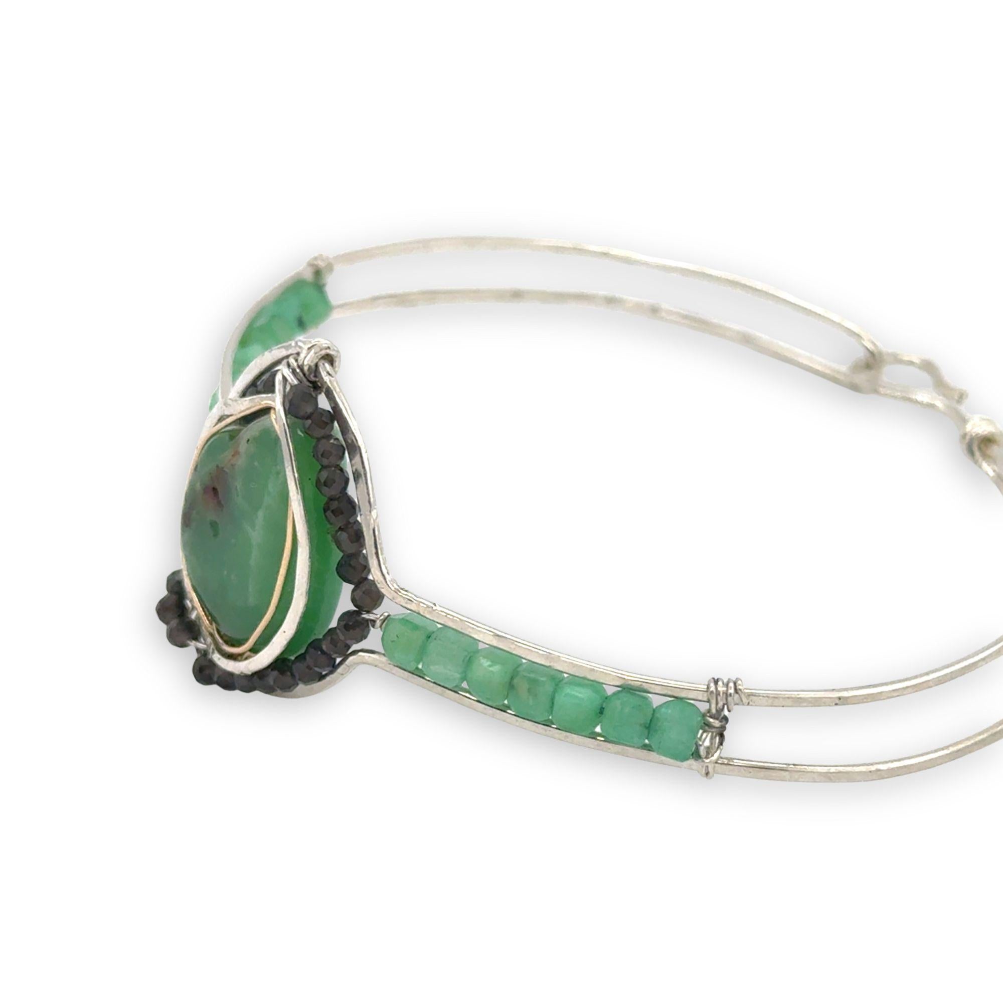 sterling silver cuff bracelet with large chrysroprase smooth nugget center surrounding by gold filled wire and green obsidian, finished off with bright chrysoprase cube gemstones