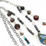 double strand darkened sterling silver necklace with chrysocolla, chocolate fresh water pearl, striped brown agate, and a chrysocolla faceted gemstone drop
