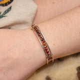 Sterling silver skinny bracelet with hessonite garnet coins and pyrite gemstones, lined with oxidized sterling silver twist wires