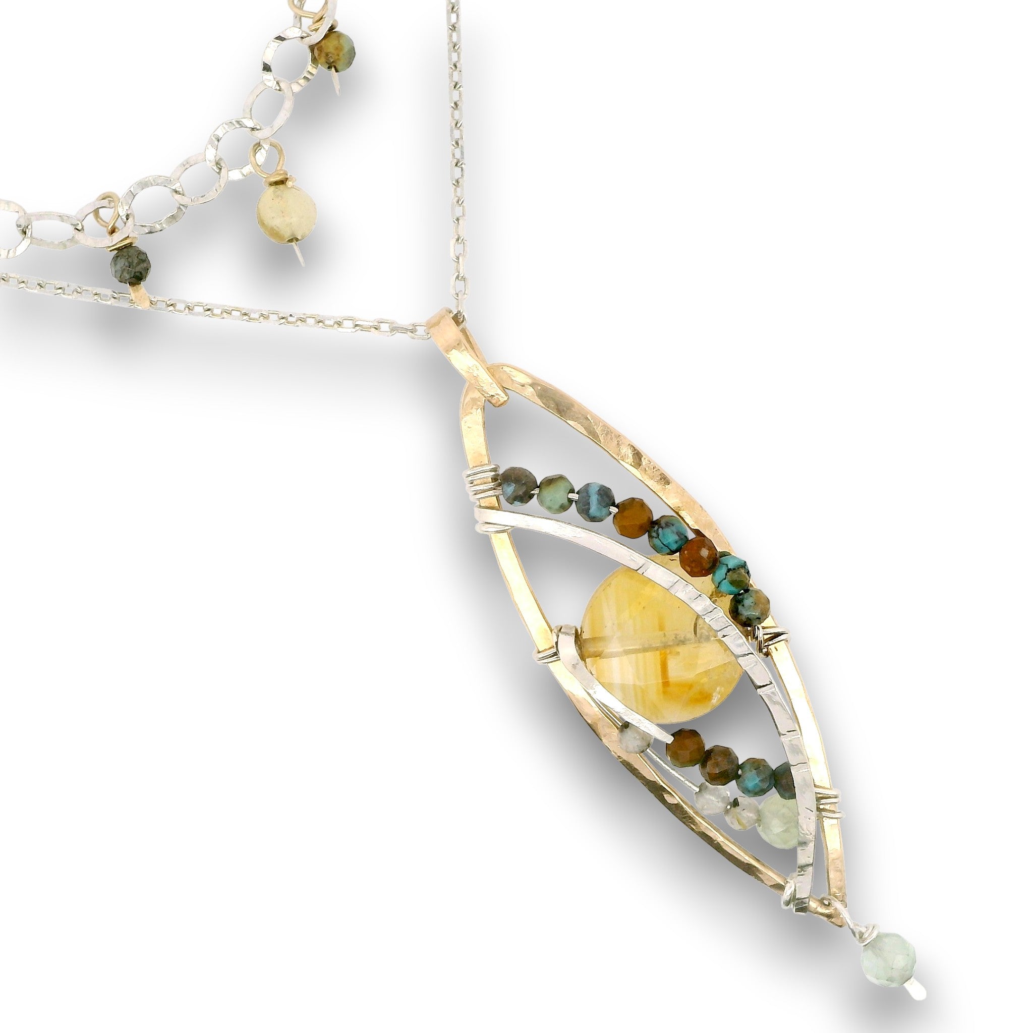 a double layered necklace, the first layer with a Bronze marquise pendant embellished with a faceted citrine coin, prehnite, and turquoise gemstones on sterling silver wire, and the second layer with delicate gemstone charms