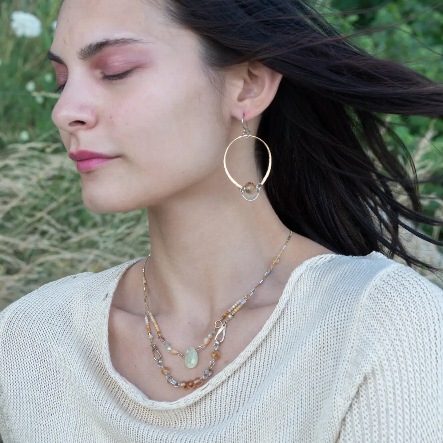 A pair of bronze handmade hoops with citrine faceted orb gemstones and sterling silver swinging hinges 