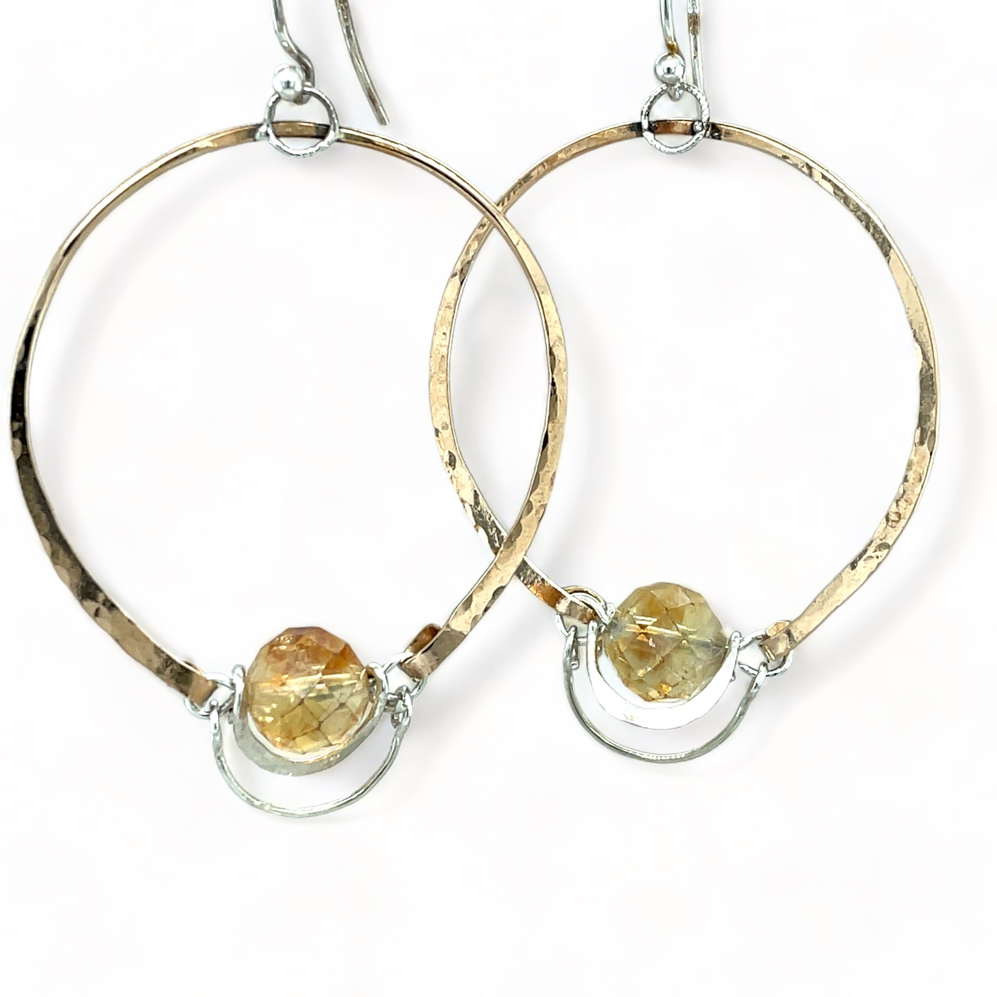 A pair of bronze handmade hoops with citrine faceted orb gemstones and sterling silver swinging hinges 